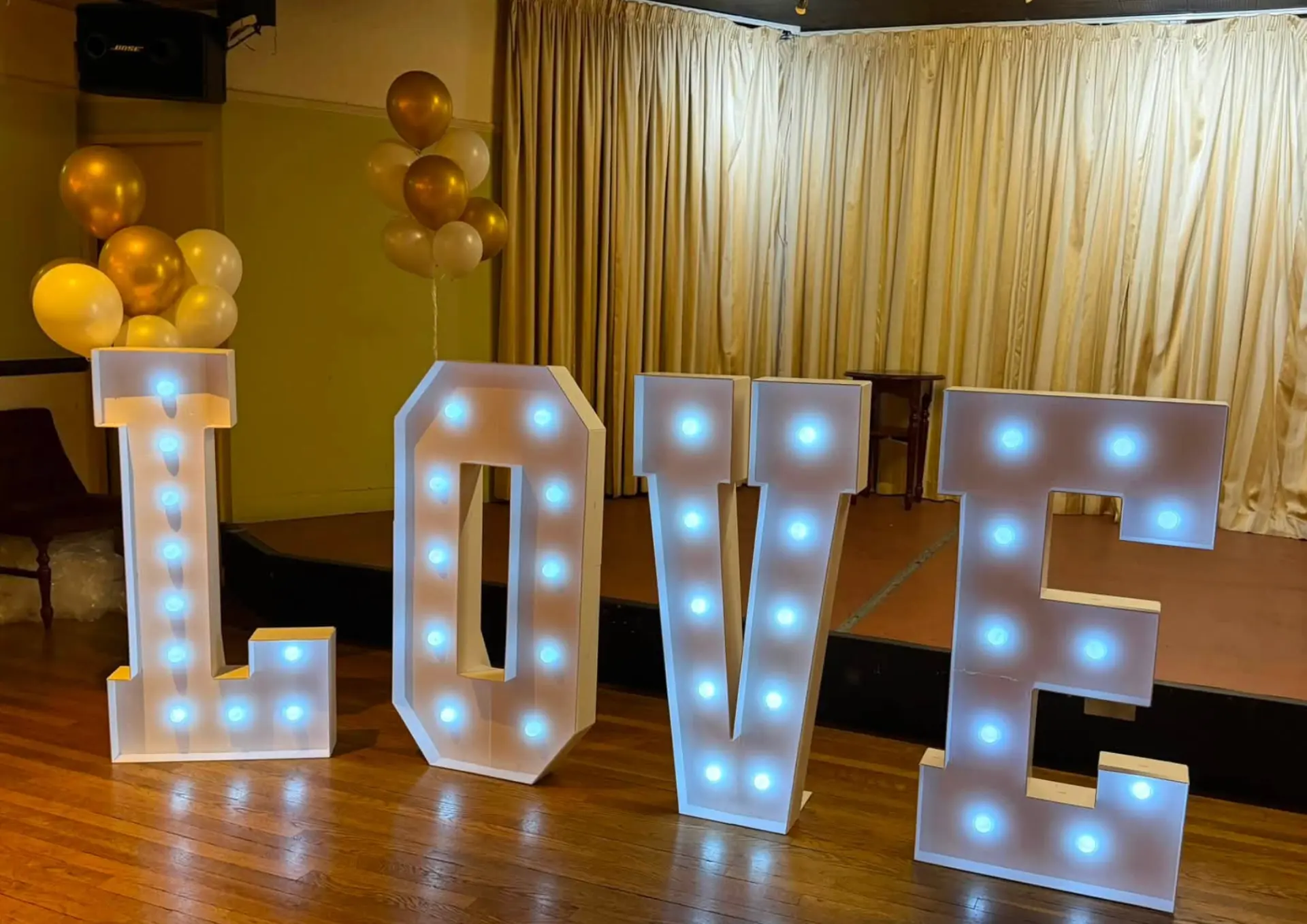 Light-up LOVE letters glowing at night